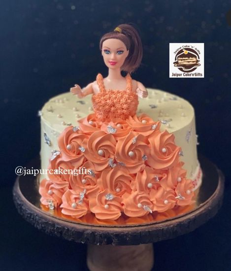 Picture of Orange Colour Doll Cake